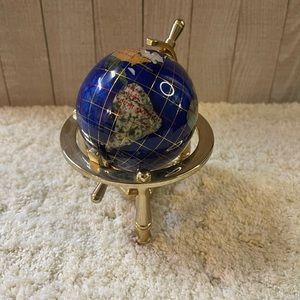 Atlas Made With Precious Stones On A Brass…